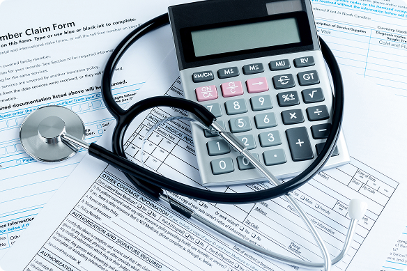 Calculator, stethoscope, insurance paperwork.