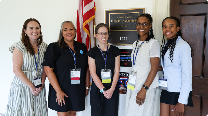 A group of women in the halls of Congress.