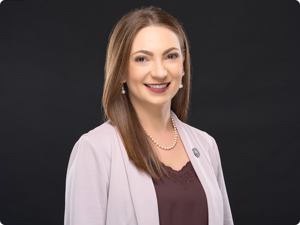 Portrait of a young woman volunteer smiling to the camera