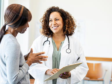 A woman consulting with a female physician