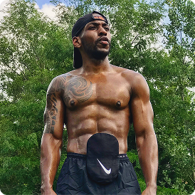 Extremely fit man with strong muscles wearing gym attire with visible ostomy