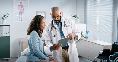 Patient discussing digestive symptoms with a healthcare provider