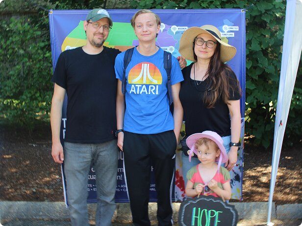 Parents with their teenage son and toddler daughter