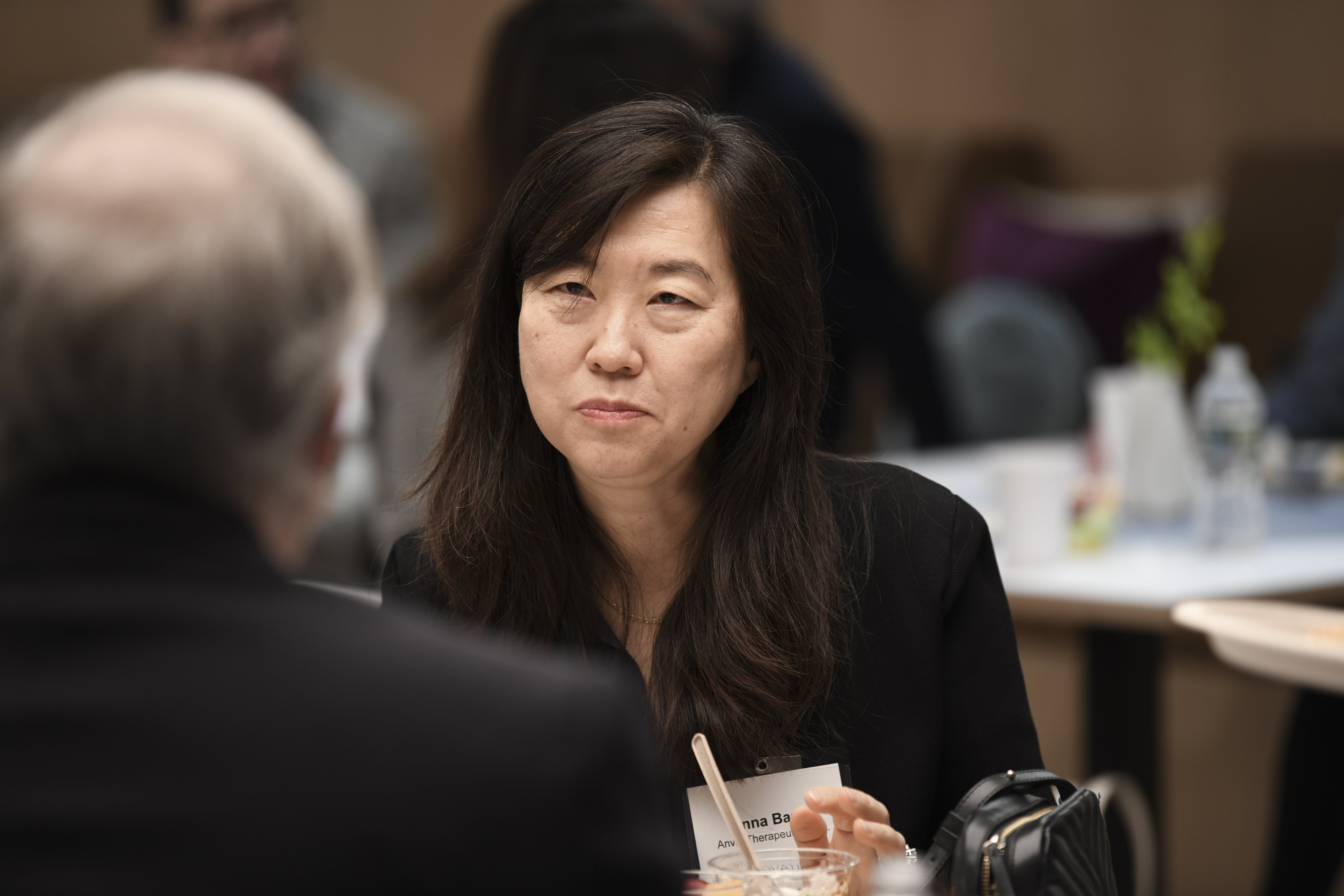 Attendees chat in the conference center