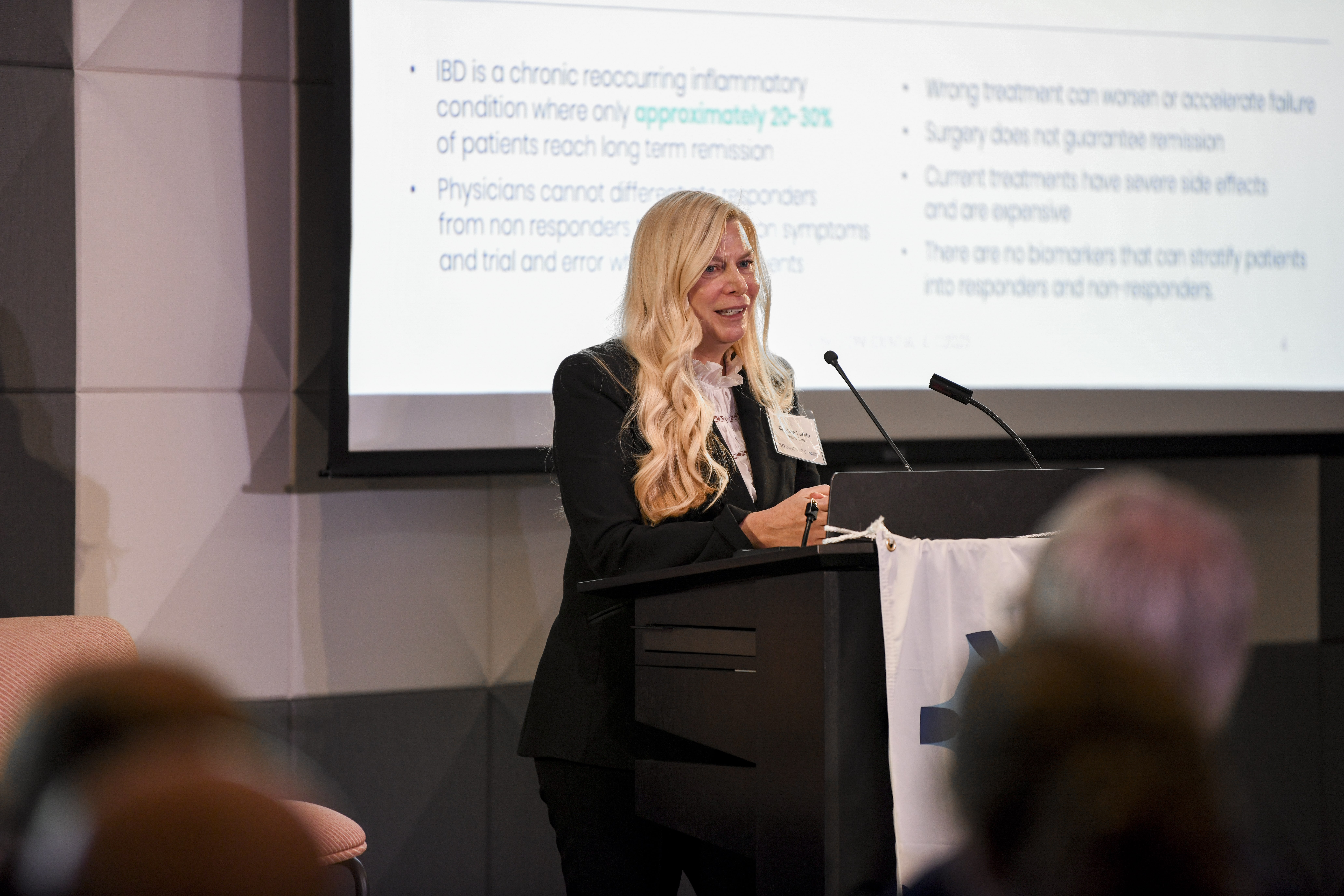 Women address crowd at podium