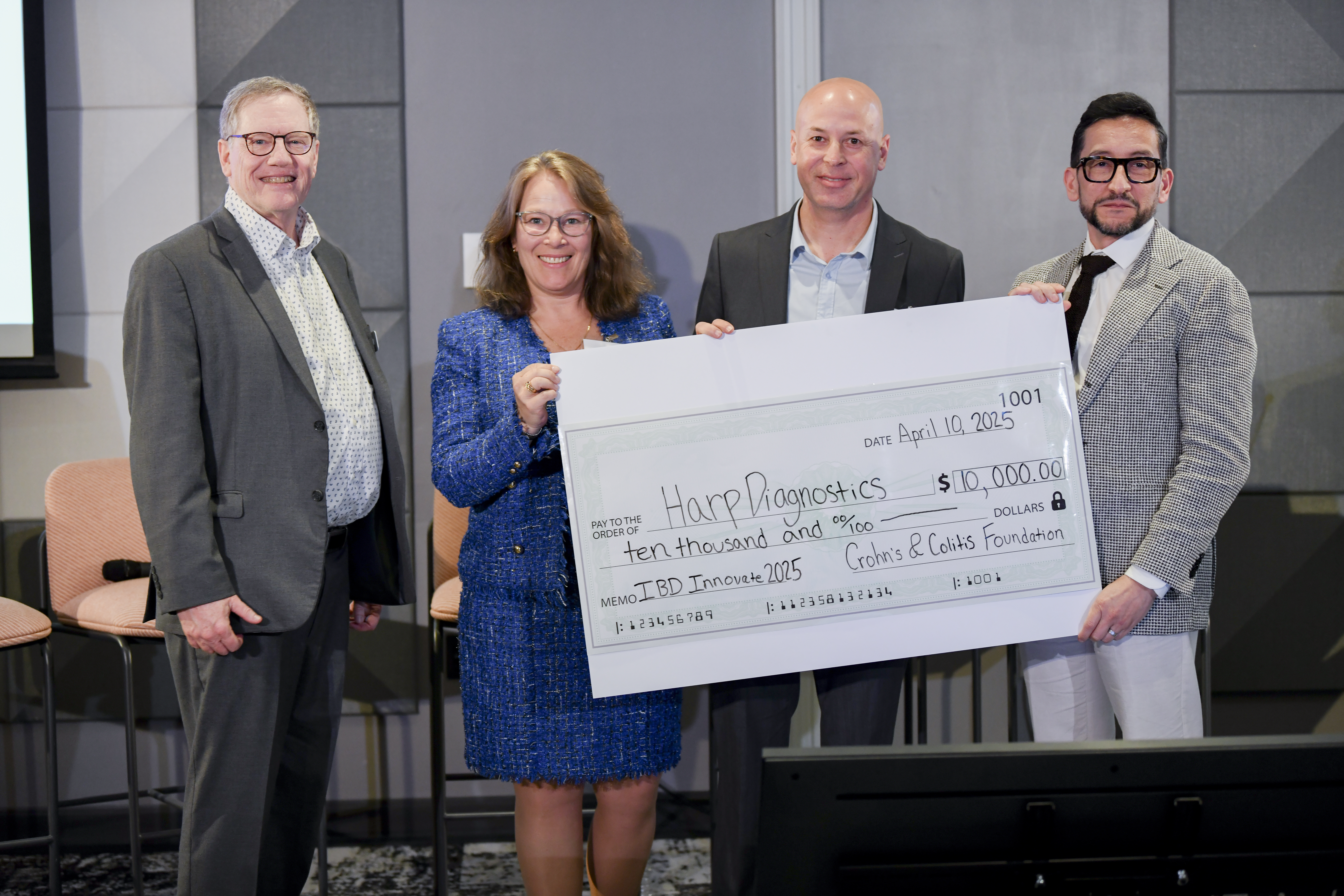 IBD Ventures team presents check to Shark Tank pitch winner