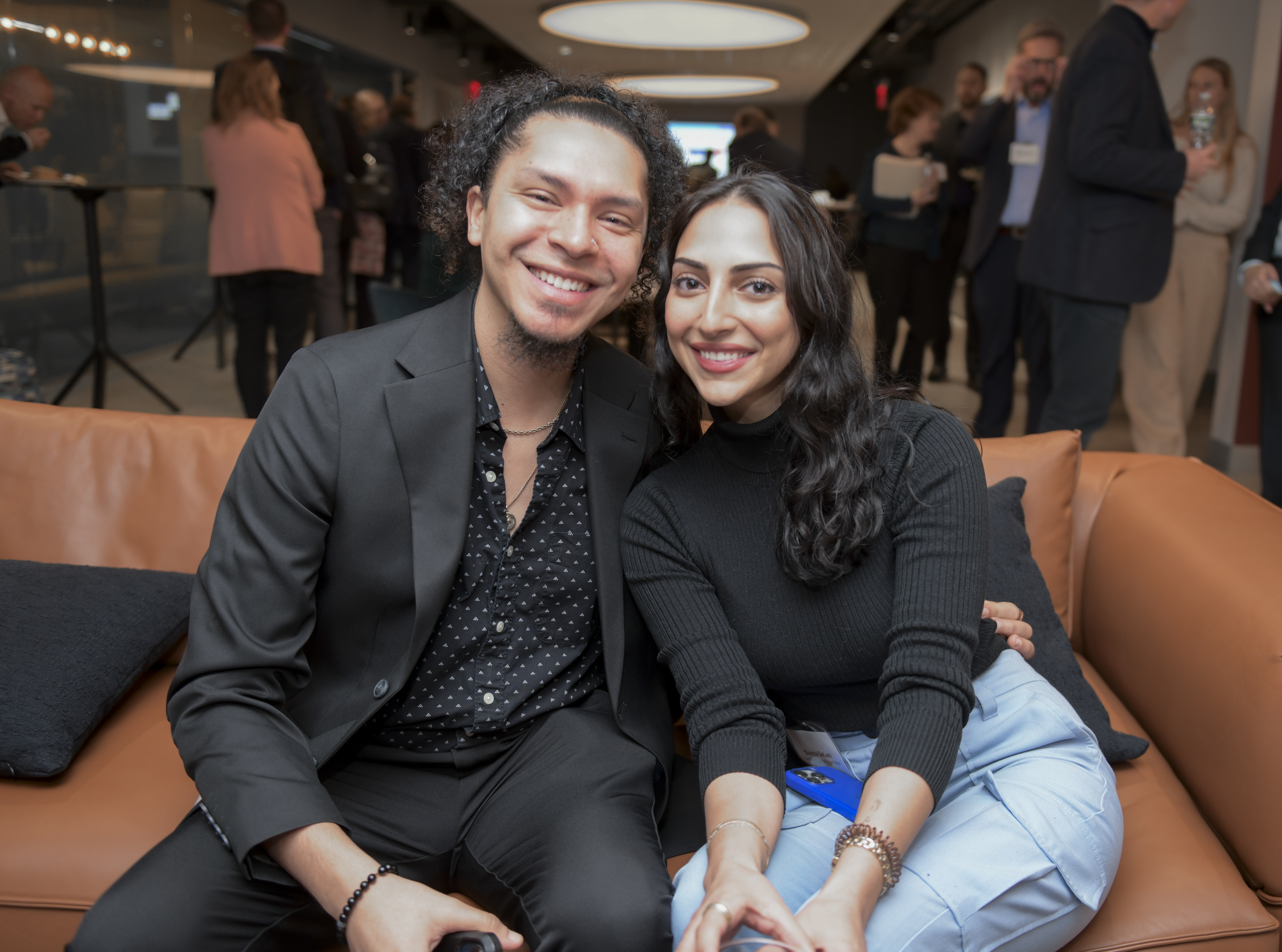 Saxl Rose sits with girlfriend and smiles for camera