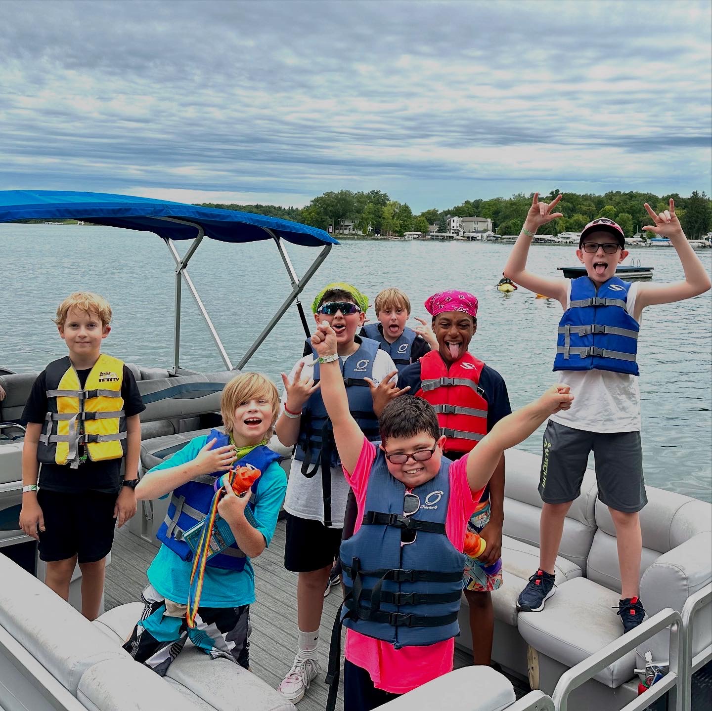 Camp Oasis campers enjoy outdoor activities like boating on a lake
