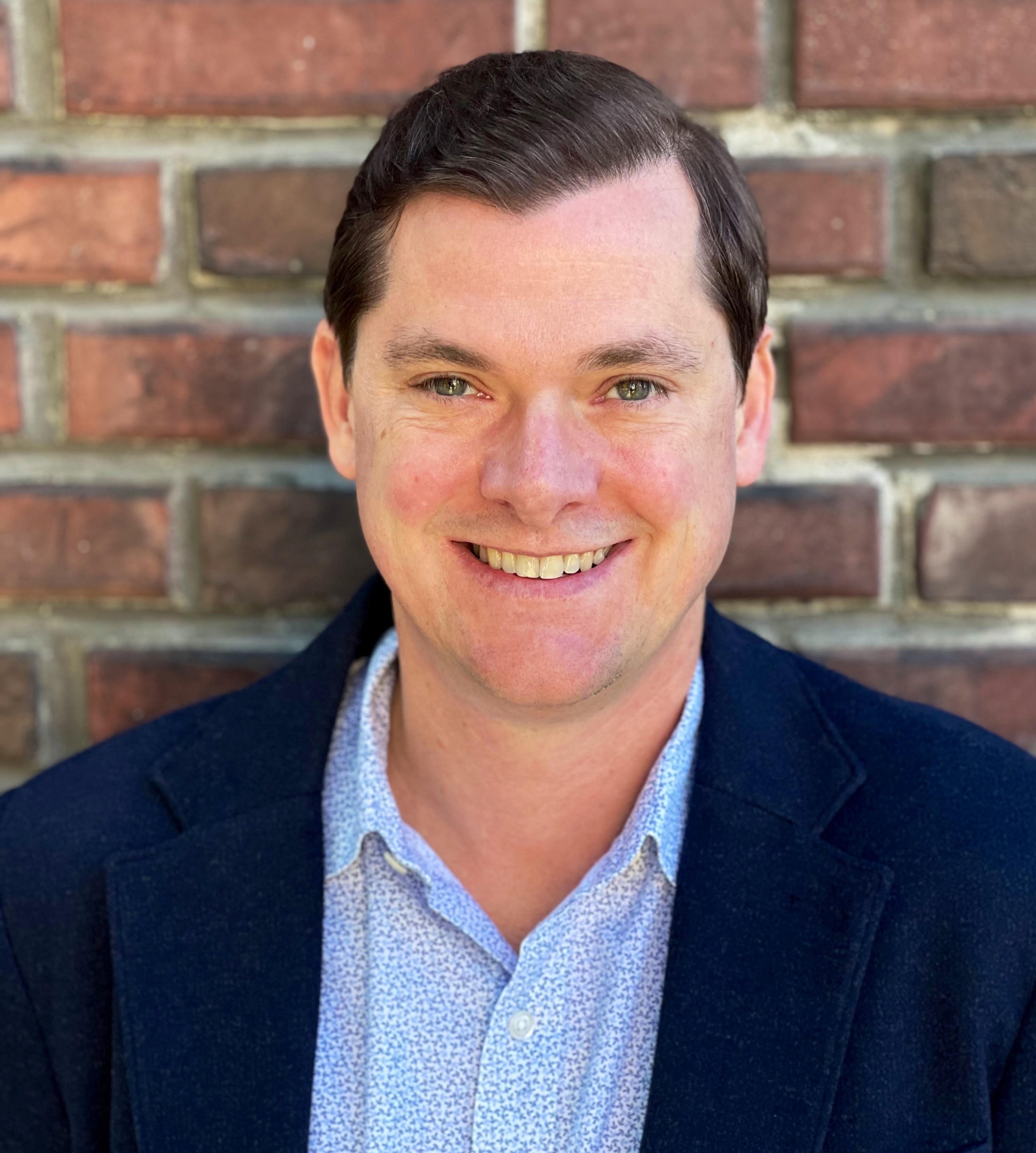 Professional headshot of a man