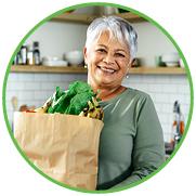 Smiling woman with groceries
