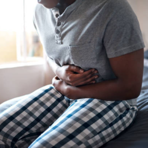 Man clutching abdomen