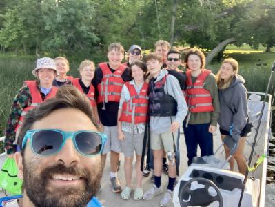 Eitan smiles for a selfie with camp oasis campers
