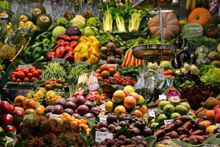 Produce section of grocery store filled with bright fruits and vegetables
