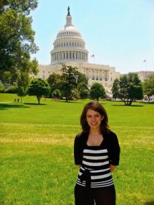 Ally Bain stands in front of the capitol building, advocating for restroom access