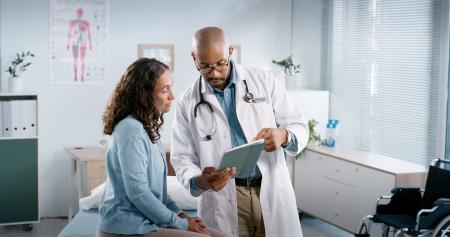 Patient discussing digestive symptoms with their provider
