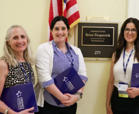 3 people waiting outside of Rep. Brian Fitzpatrick's office