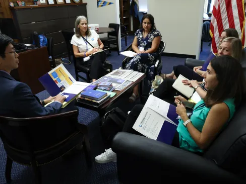 6 people sitting around a table