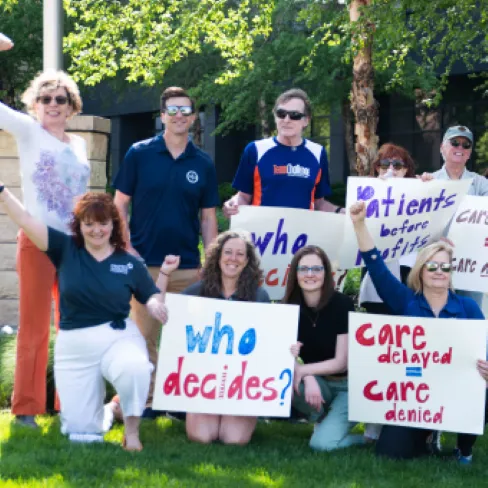 Advocacy group holding paper posters