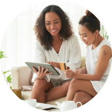 Women shopping online with a tablet