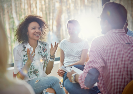 Woman talking in group therapy circle