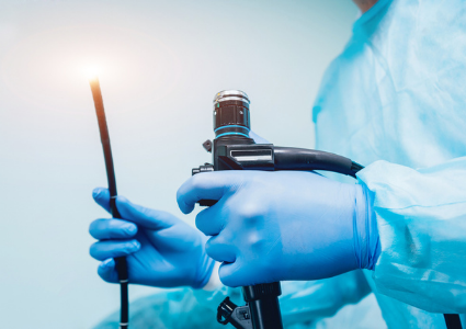 Surgeon holding endoscopy tool