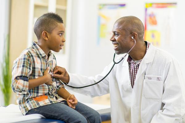Child being examined for Crohn’s disease symptoms